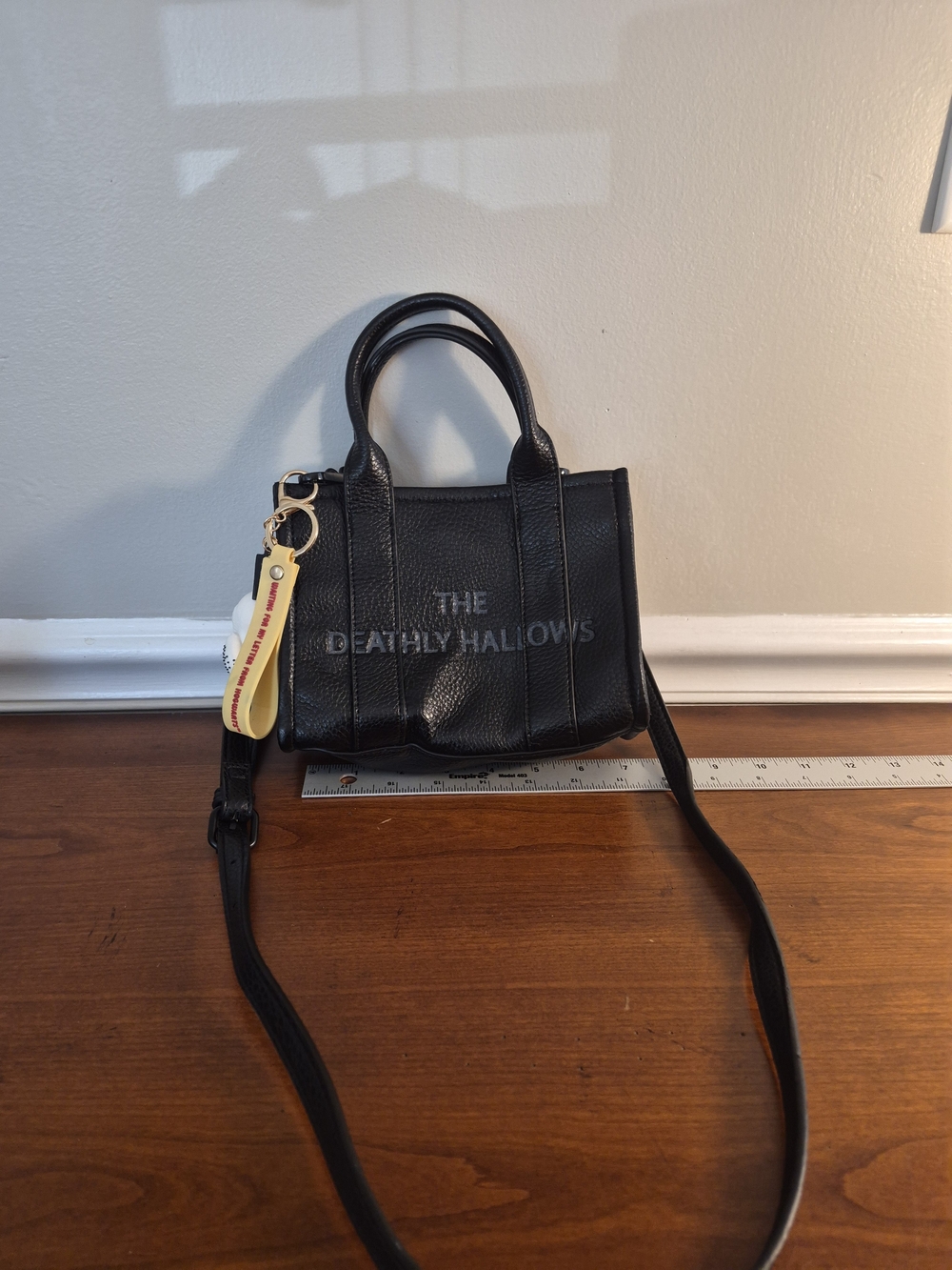 Black Leather Mini Crossbody Bag with 'The Deathly Hallows' Embossing